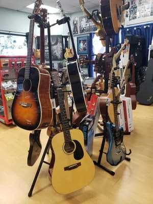 Electric guitars hanging on the wall of the Big Island Guitars shop