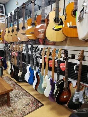 Guitars and gear filling the walls inside Big Island Guitars